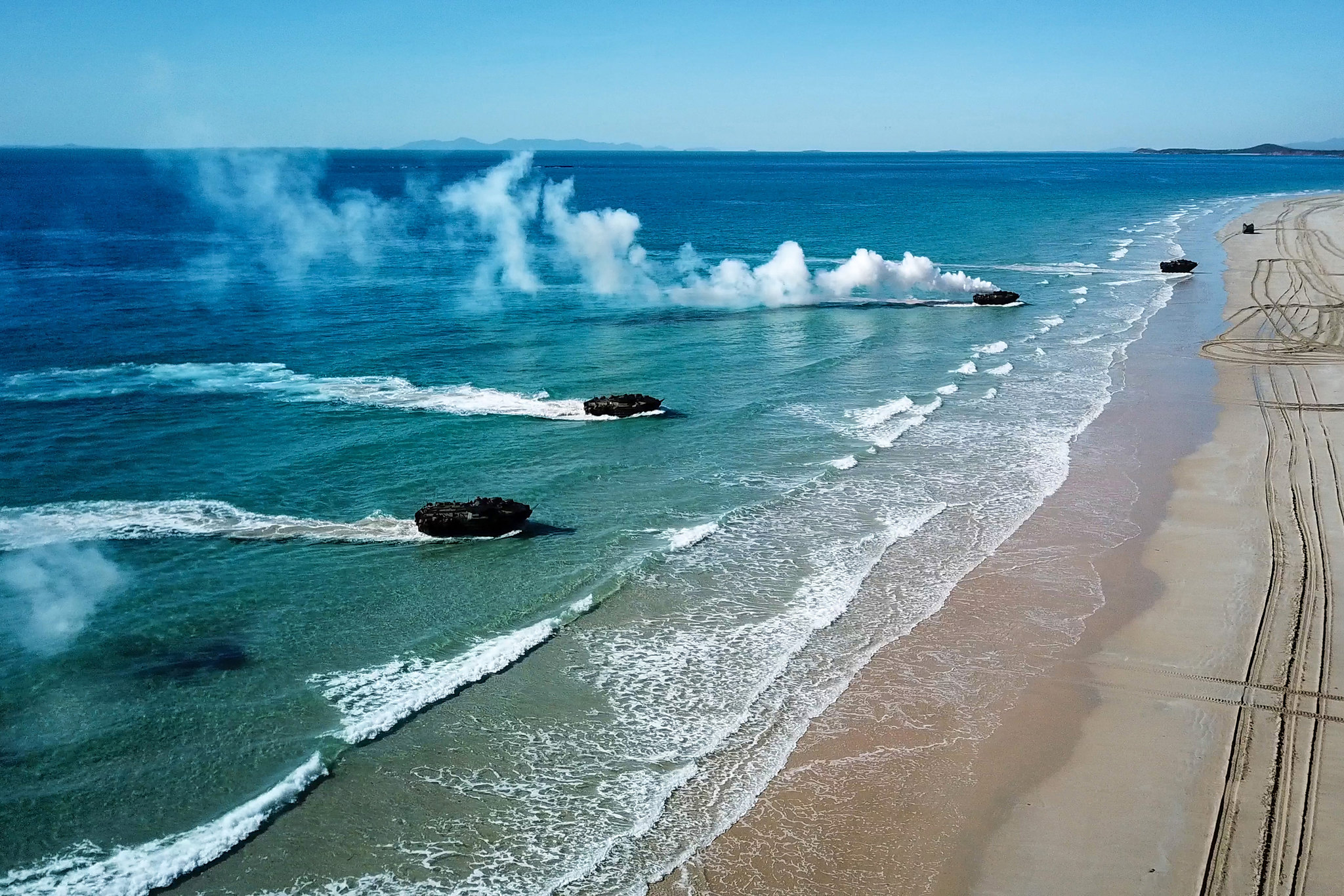Amphibious assault vehicles approach Langhams Beach in Stanage Bay in Queensland, Australia, during a multinational amphibious landing July 16, 2019, as part of exercise Talisman Sabre 2019.