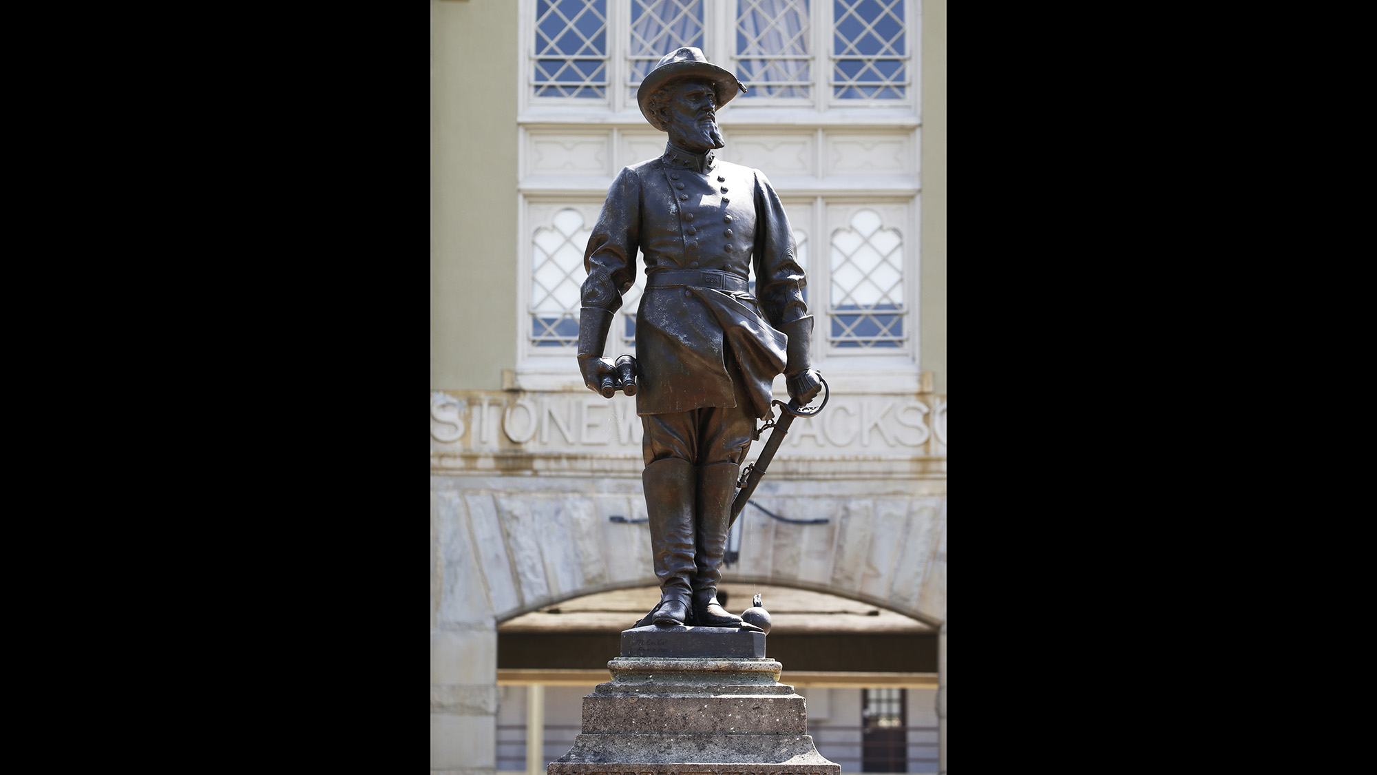A statue of Confederate Gen. Thomas “Stonewall” Jackson stands at the entrance to the barracks at the Virginia Military Institute in Lexington, Va., in this In this July 15, 2020, file photo.