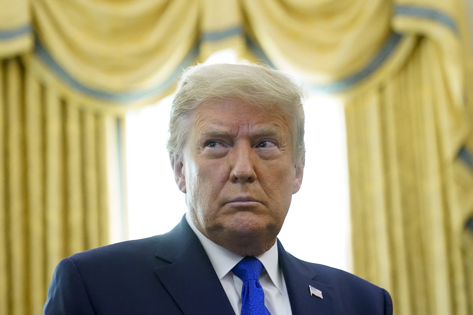 In this Dec. 7, 2020, photo,President Donald Trump in the Oval Office of the White House in Washington.