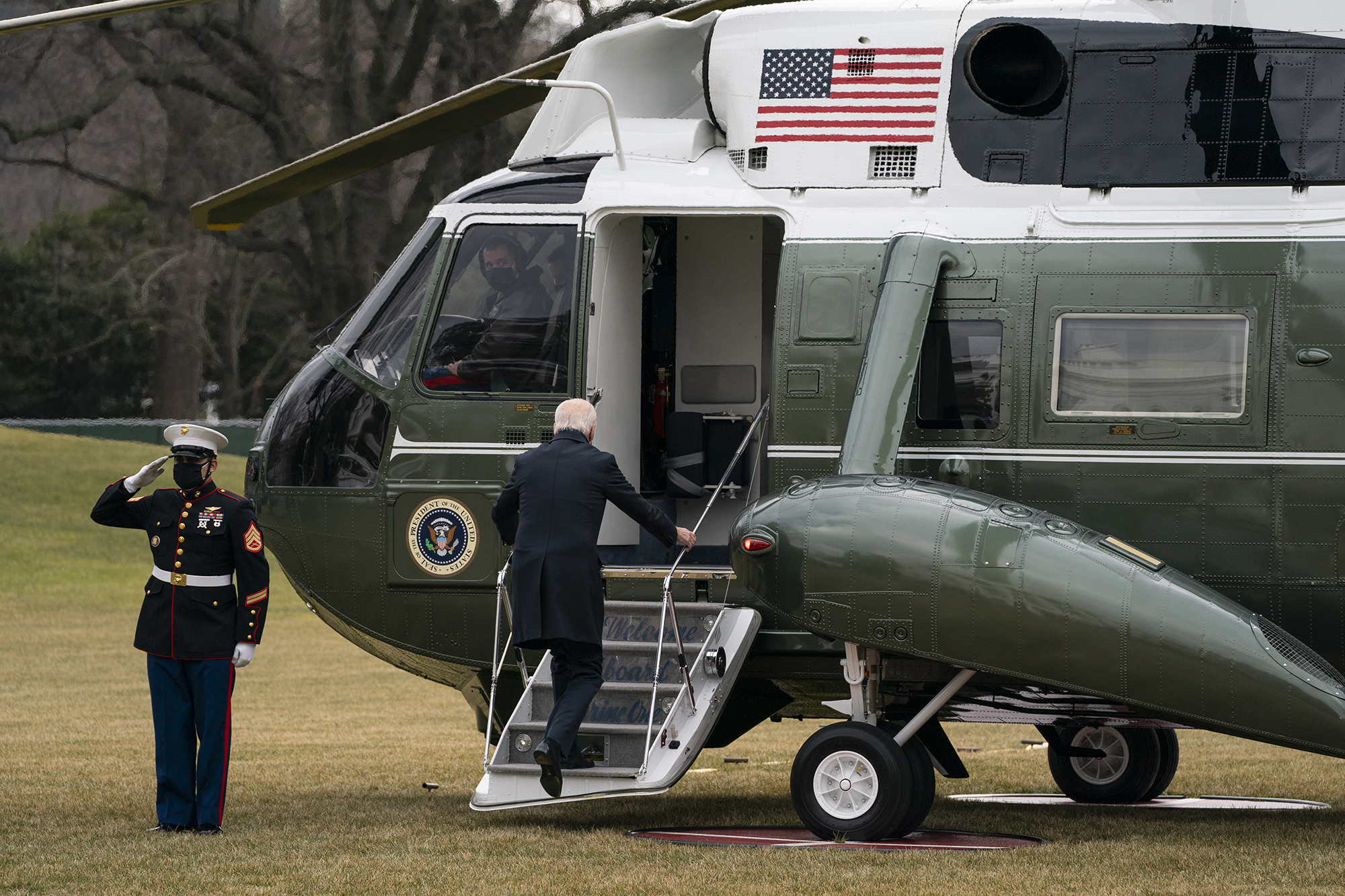 President Joe Biden boards Marine One to visit wounded troops at Walter Reed National Military Medical Center, on the South Lawn of the White House, Friday, Jan. 29, 2021, in Washington.