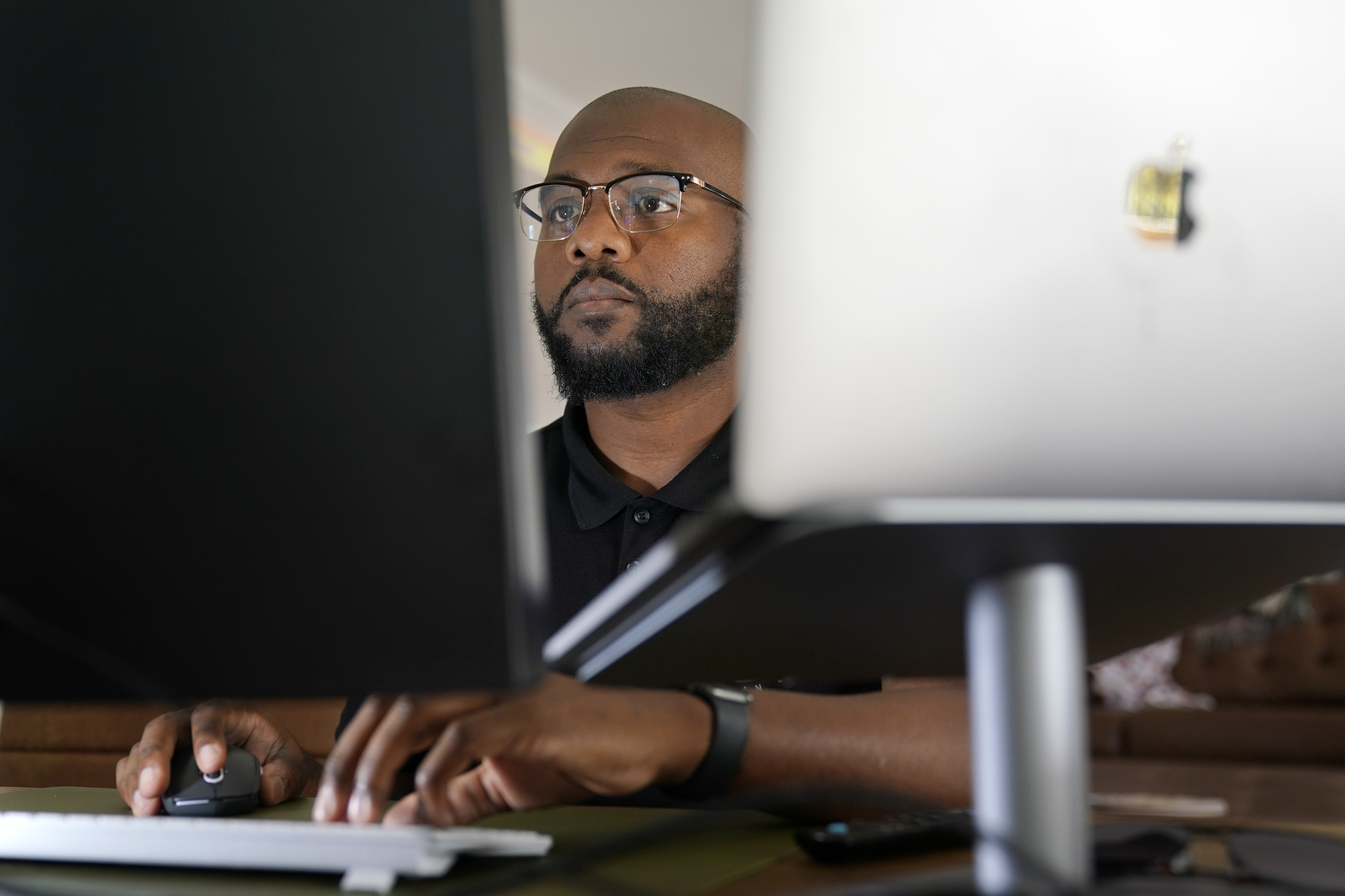 Phillip Slaughter, who served in the U.S. Army for 18 years, works in his home office Nov. 10, 2022, in Clarksville, Tenn.